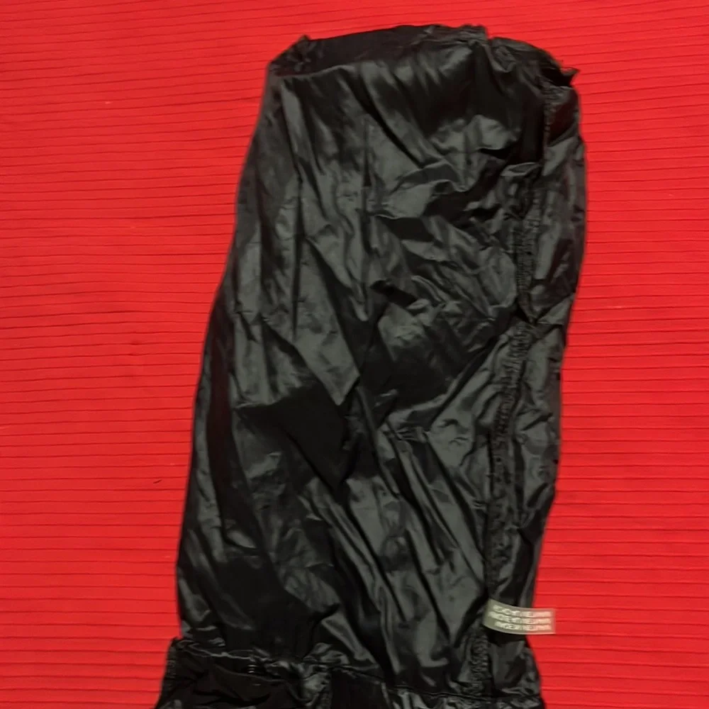 CK black draw string bag, used but great condition. Black and silver 12” x 5”
